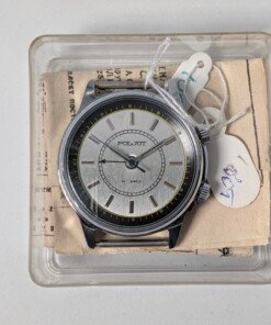 Orologio svegliarino meccanico Poljot 2612.1 NOS con quadrante argentato, indici applicati, doppia corona e il suo passaporto originale.