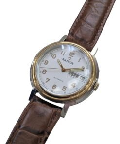 Radius Automatico Vintage Cassa Bicolore Calibro Slava 2427 – Grade B 14 Orologio automatico vintage russo Radius con quadrante crema, numeri arabi dorati, datario SAB 3 e cinturino in pelle marrone.