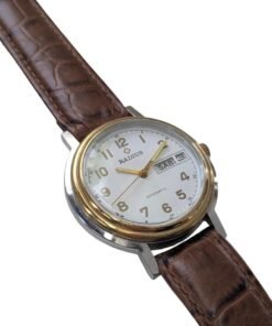 Radius Automatico Vintage Cassa Bicolore Calibro Slava 2427 – Grade B 15 Orologio da collezione sovietico vintage Radius automatico, con cassa bicolore, quadrante bianco giorno/data e cinturino in pelle marrone.